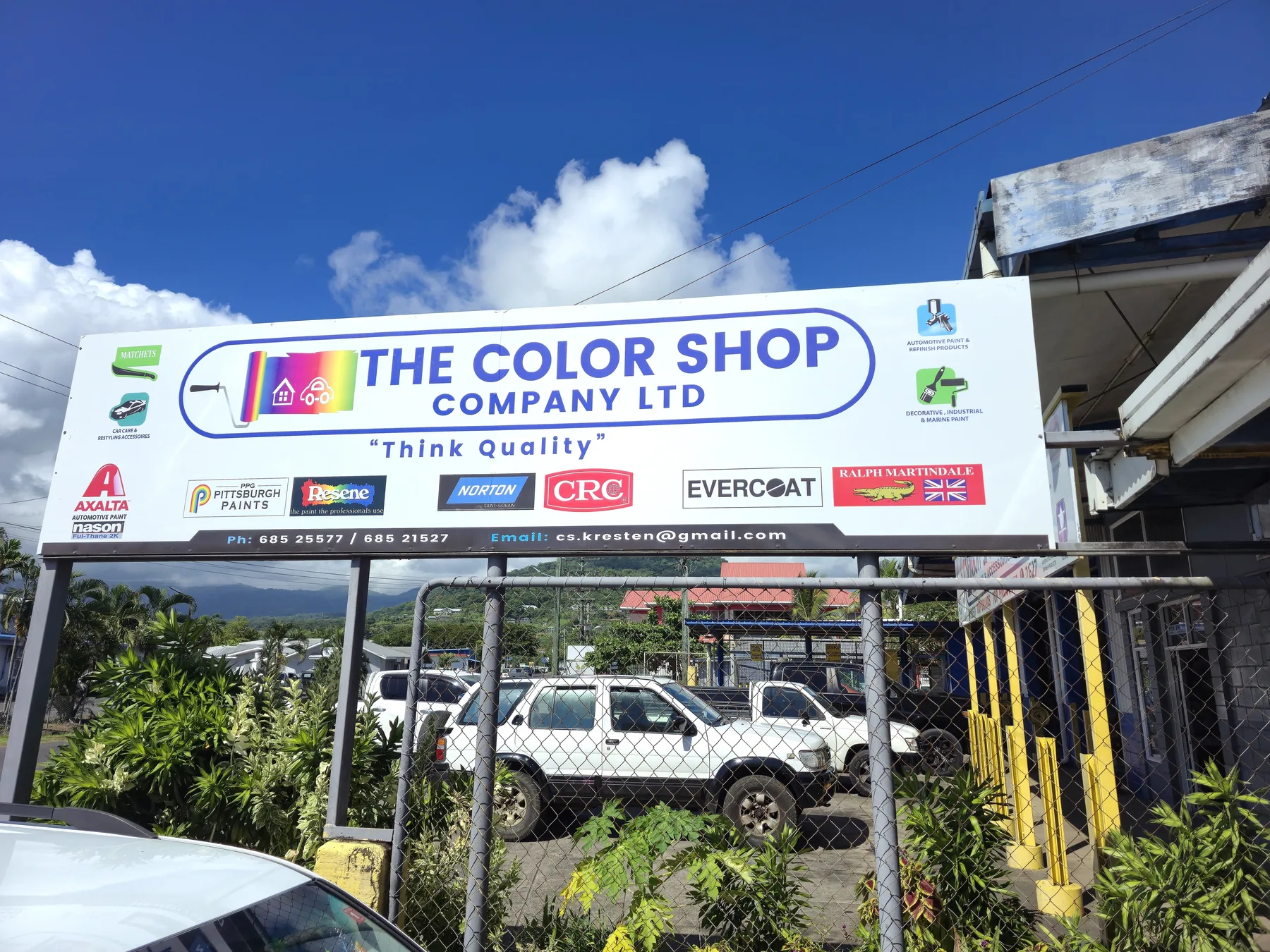 The Color Shop roadside sign with brand partners.