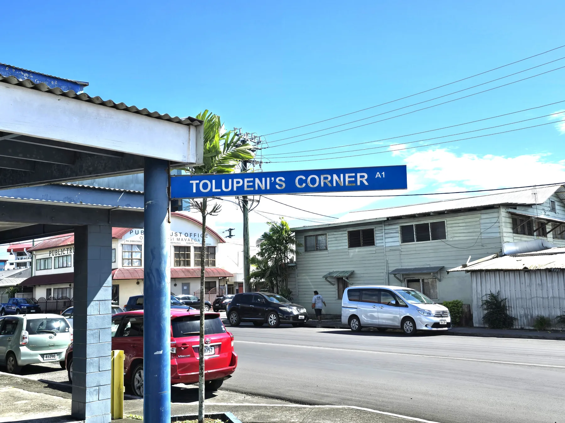Tolupeni's Corner sign near The Color Shop in Apia.